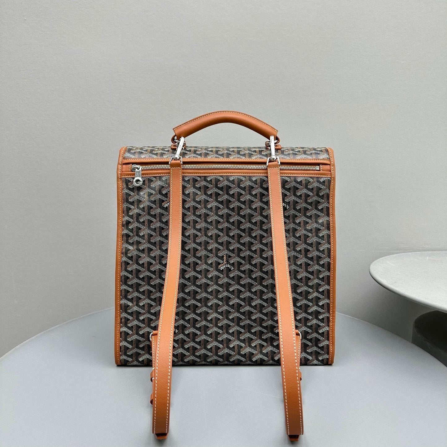 LEGER BACKPACK 37 IN BLACK GOYARDINE CANVAS WITH TAN CALFSKIN TRIM