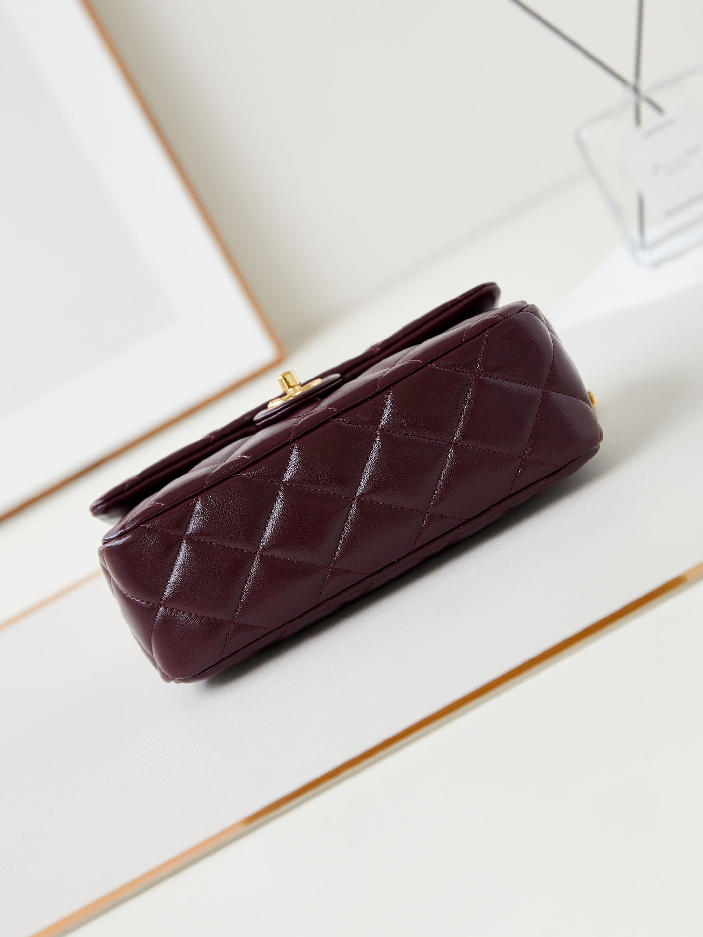 FLAP BAG WITH TOP HANDLE 25 IN WINE RED OIL-WAX LAMBSKIN GOLD HARDWARE
