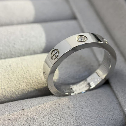 [AURORA]LIEBESRING 4MM 1 DIAMANT SILBER