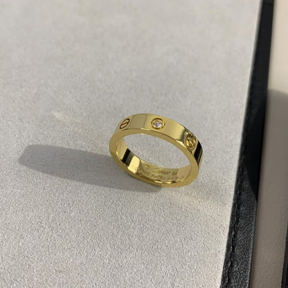 [AURORA]LIEBESRING 4MM 1 DIAMANT GOLD