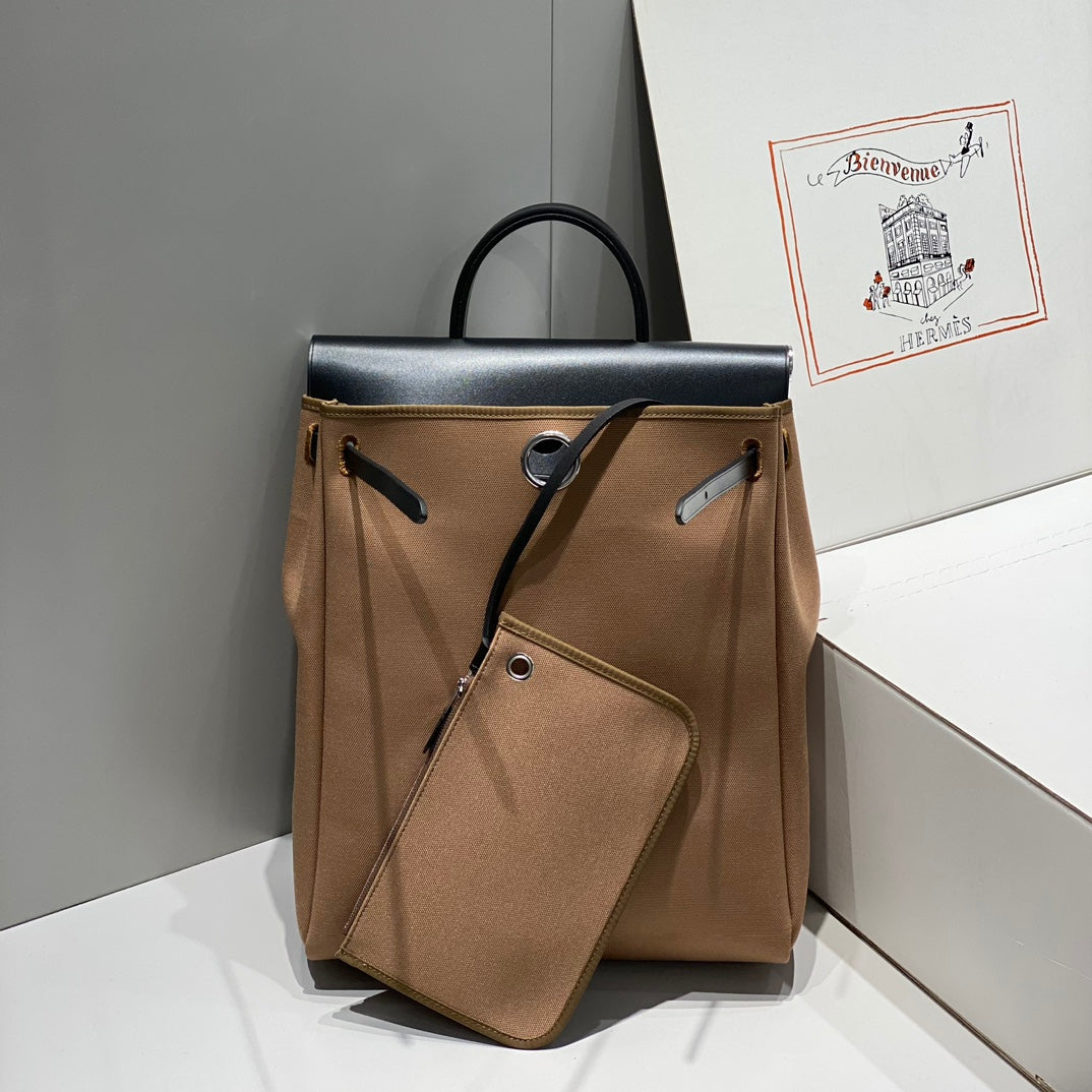 HERBAG A DOS ZIP RETOURNE BACKPACK 29 IN BROWN CANVAS AND BLACK CALFSKIN